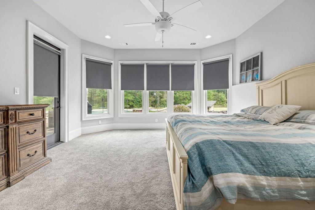 400 Harmony Road Eatonton, GA 31024 - Photo 71 of 136 a bedroom with a large bed and a window
