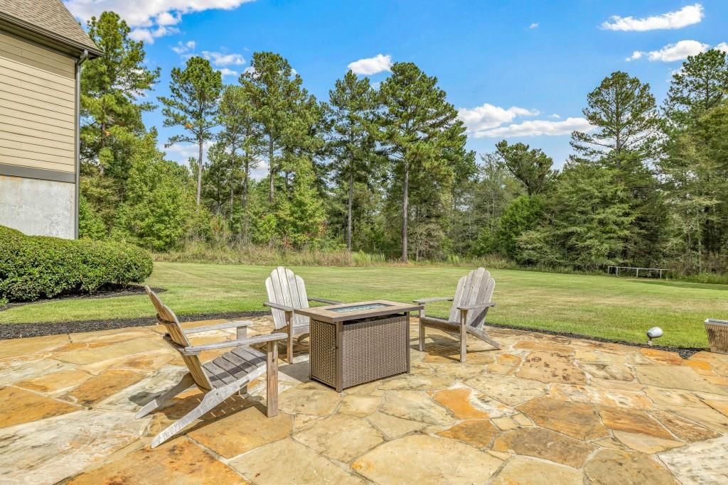 400 Harmony Road Eatonton, GA 31024 - Photo 85 of 136 a view of a swimming pool with a patio and a yard