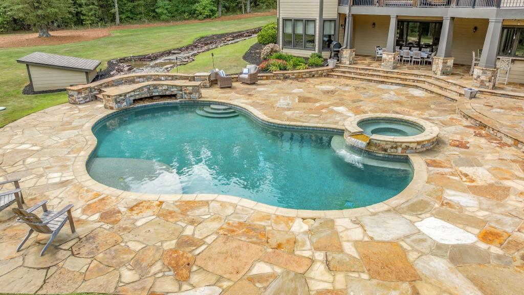 400 Harmony Road Eatonton, GA 31024 - Photo 86 of 136 a view of a swimming pool in the back of a house