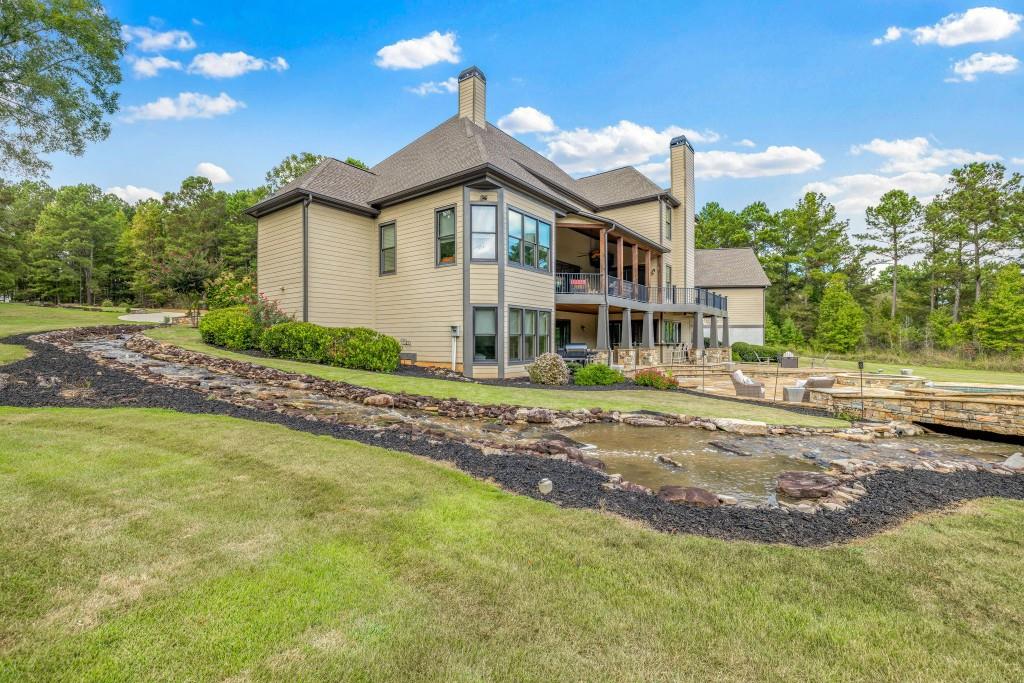 400 Harmony Road Eatonton, GA 31024 - Photo 87 of 136 a front view of a house with a yard
