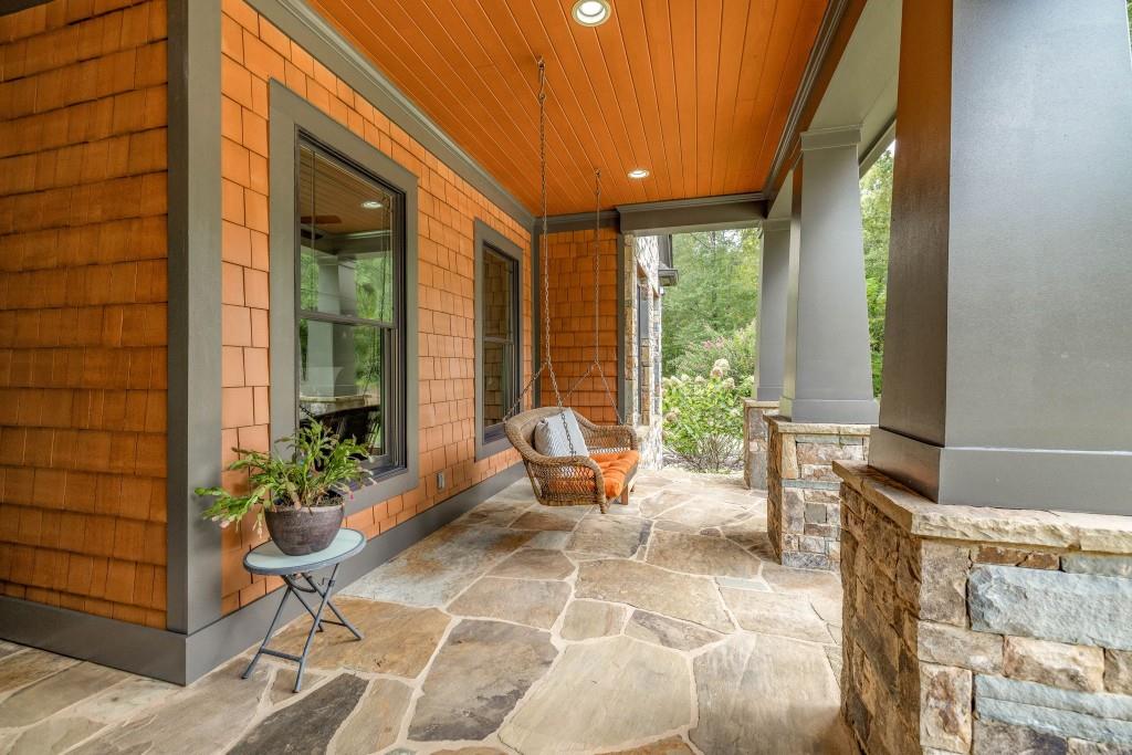 400 Harmony Road Eatonton, GA 31024 - Photo 9 of 136 a building outdoor space with patio furniture and potted plants