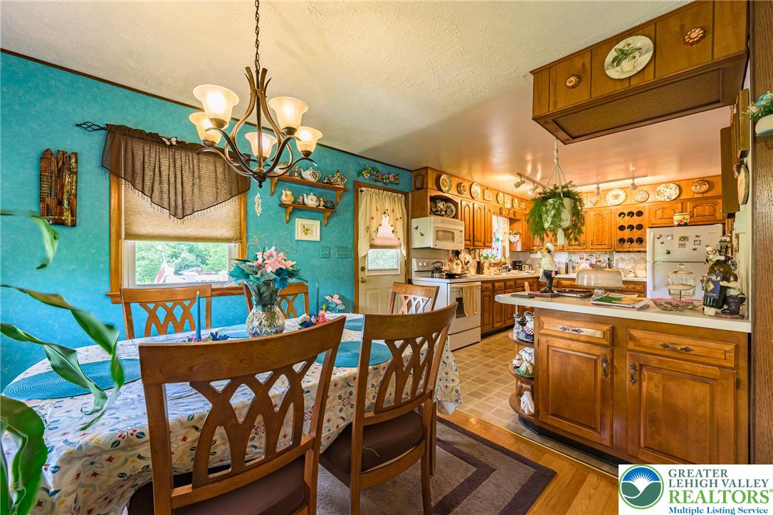 678 Interchange Road Kresgeville, PA 18333 - Photo 17 of 45 A combined dining area and kitchen provide ample space for culinary endeavors and gatherings.