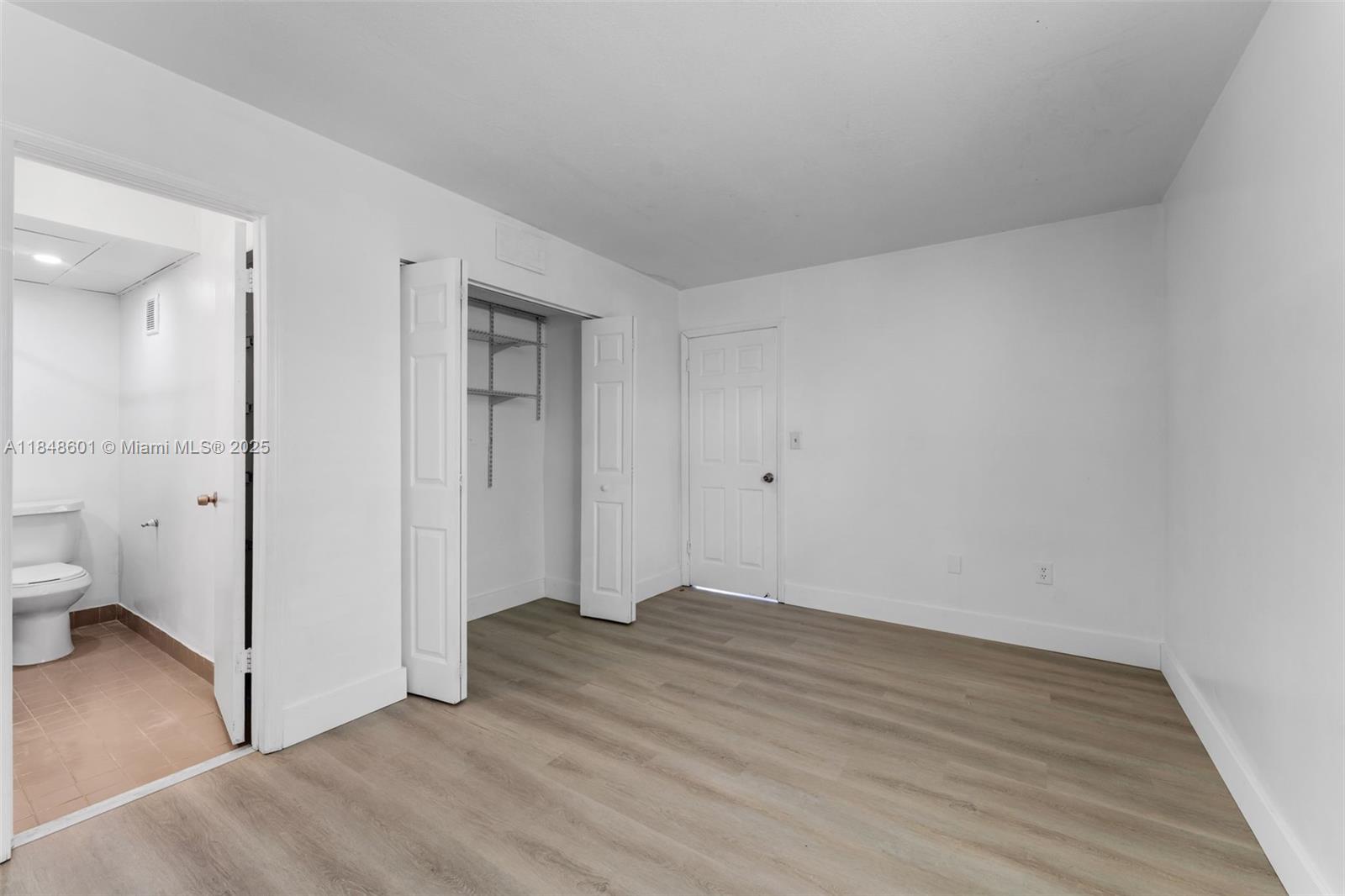 6911 Southwest 129th Avenue, Unit 2 Miami, FL 33183 - Photo 13 of 30 wooden floor in an empty room