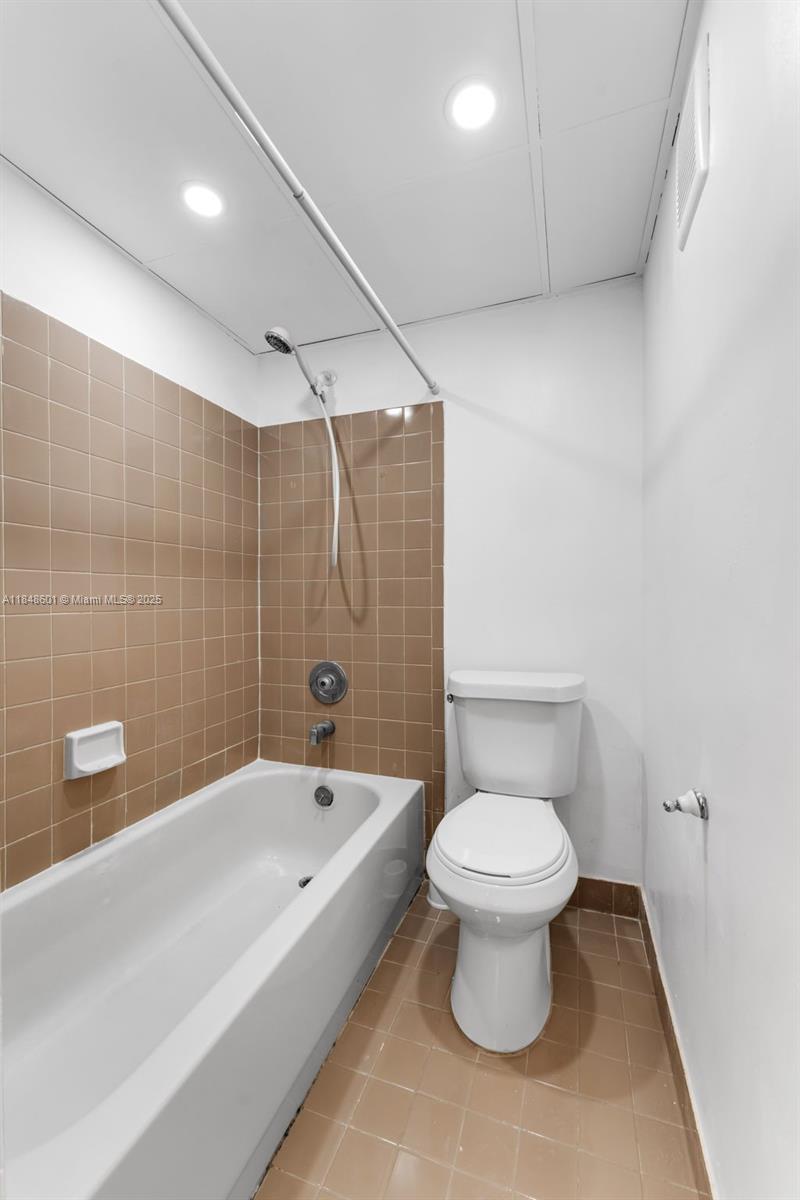 6911 Southwest 129th Avenue, Unit 2 Miami, FL 33183 - Photo 15 of 30 a bathroom with a toilet and a bathtub