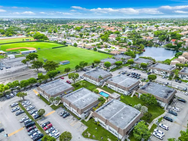 an aerial view of multiple house with yard