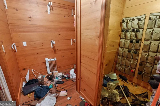 a bathroom with a toilet and a mirror