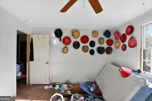 a bedroom with furniture and a window