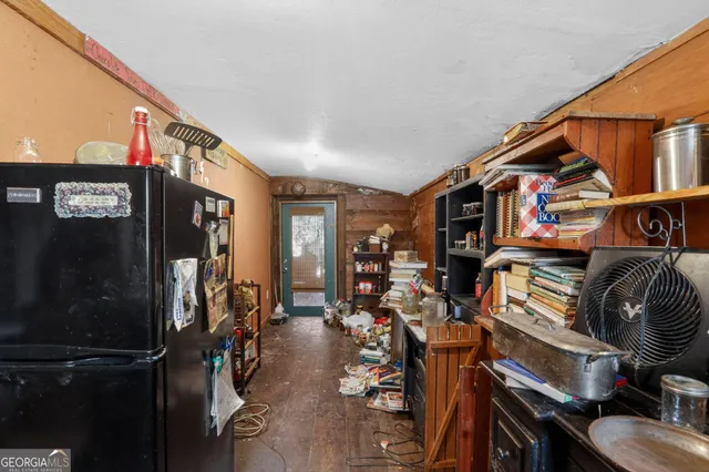 a kitchen with a refrigerator and a sink