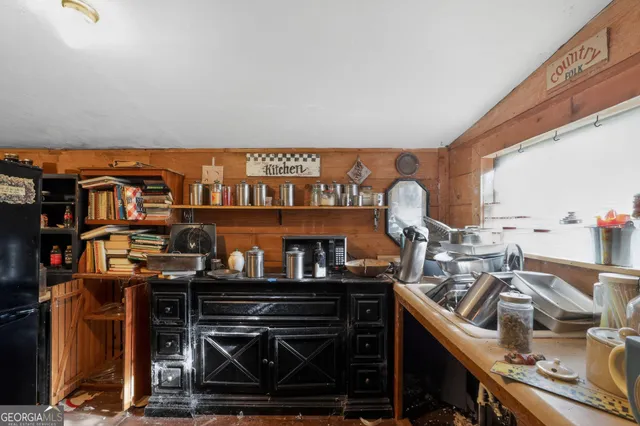 a room with lots of chairs and a chandelier