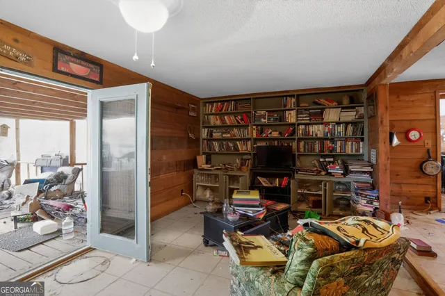 a view of a workspace with bookshelf