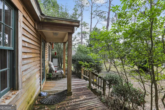 a view of road with large trees