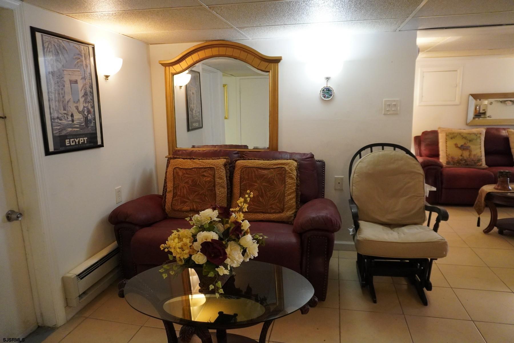 4703 Ventnor Avenue, Unit LOWER LEVEL Atlantic City, NJ 08401 - Photo 11 of 22 a living room with furniture