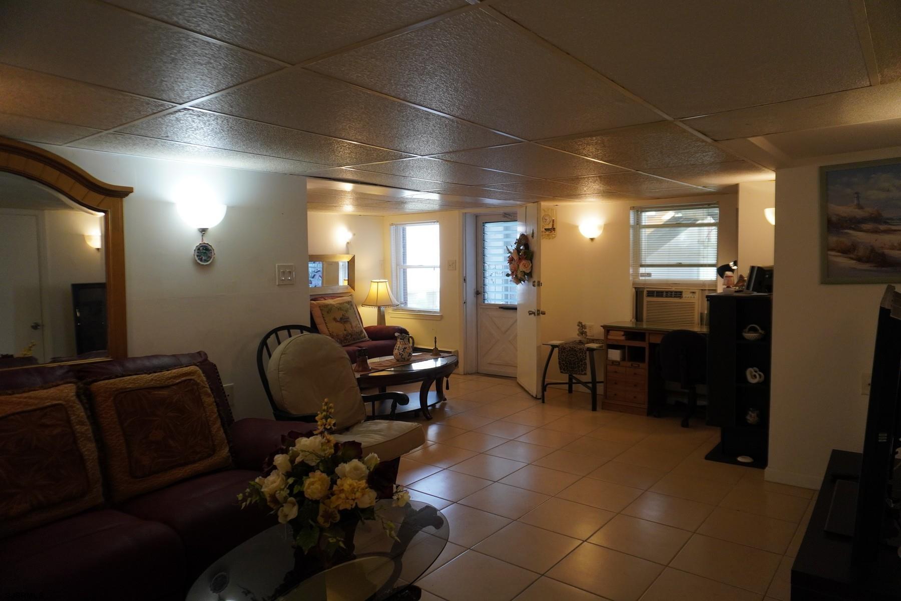 4703 Ventnor Avenue, Unit LOWER LEVEL Atlantic City, NJ 08401 - Photo 16 of 22 a room with furniture