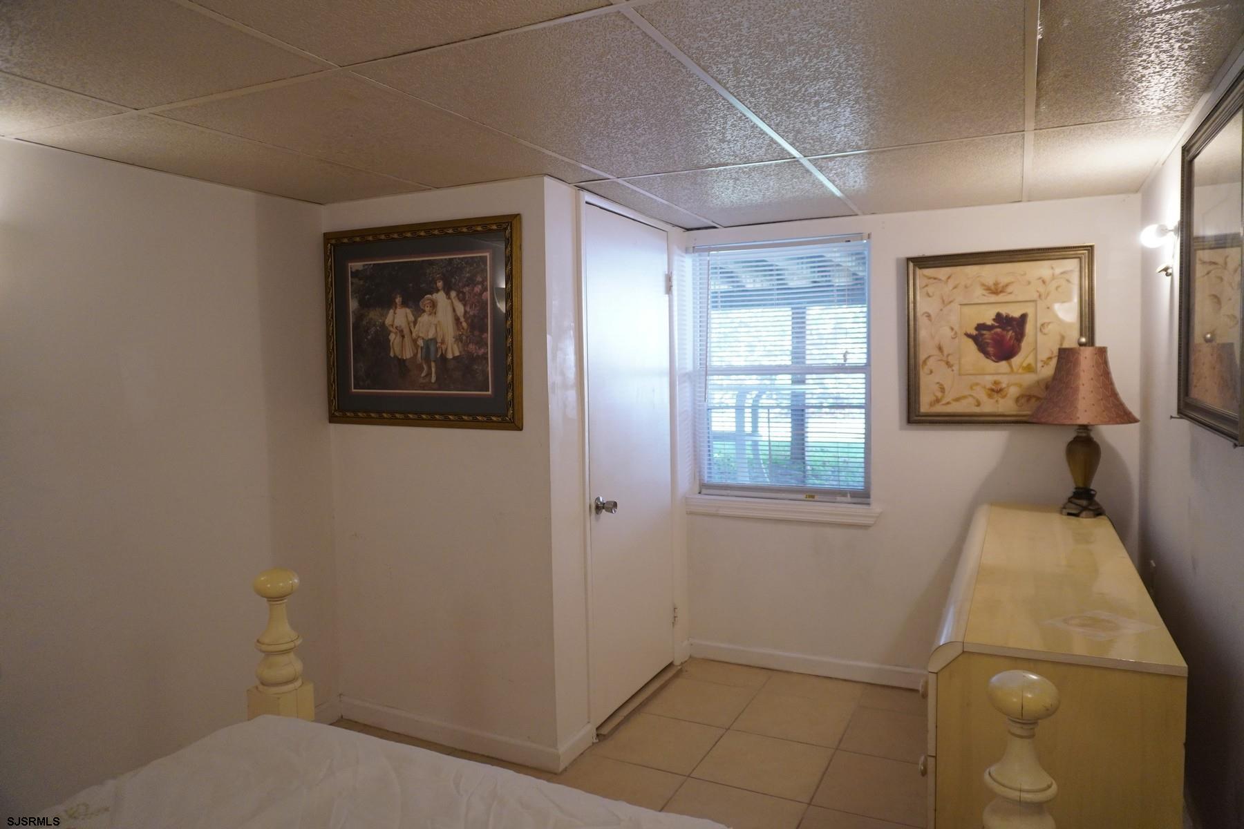 4703 Ventnor Avenue, Unit LOWER LEVEL Atlantic City, NJ 08401 - Photo 19 of 22 a bathroom with a toilet