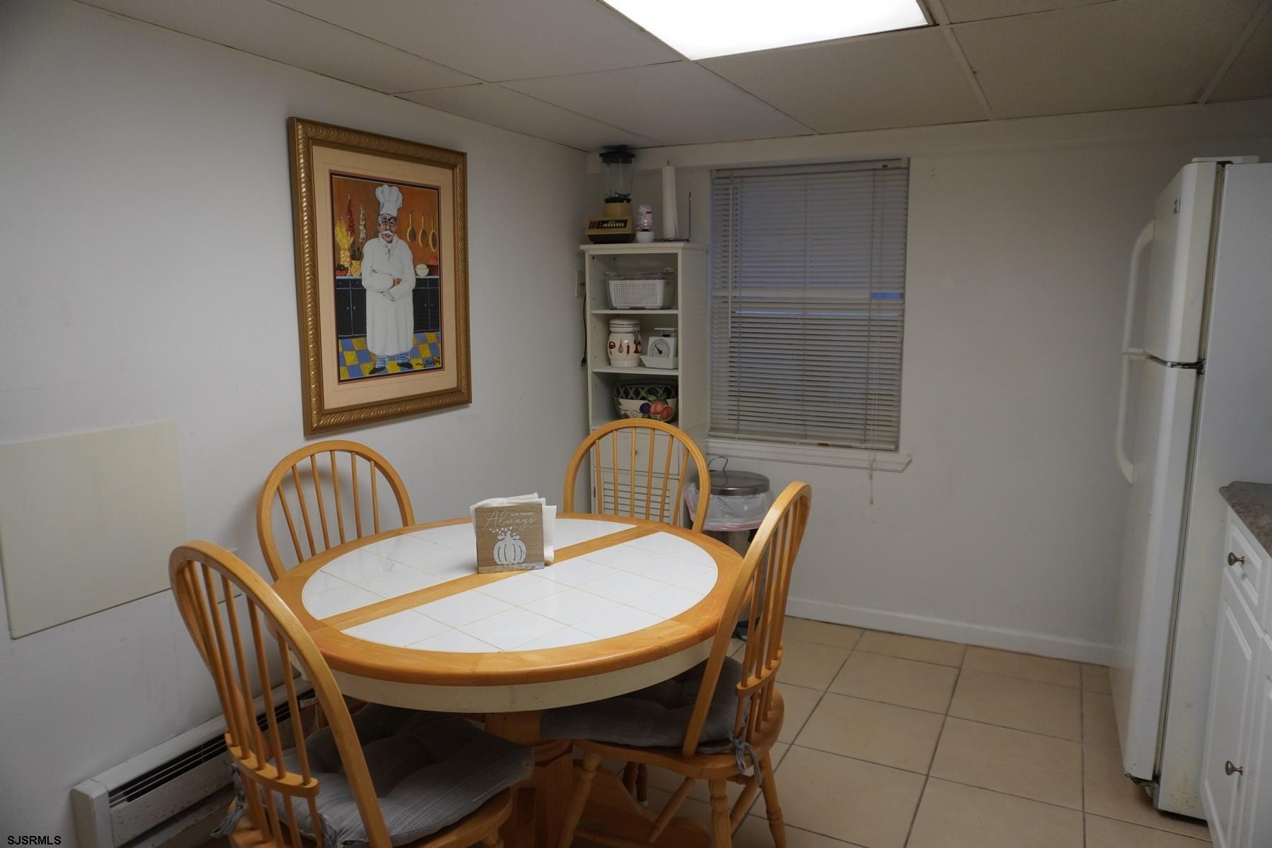 4703 Ventnor Avenue, Unit LOWER LEVEL Atlantic City, NJ 08401 - Photo 9 of 22 a view of a dining room with furniture