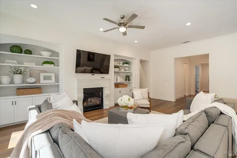 a living room with furniture fireplace and a flat screen tv