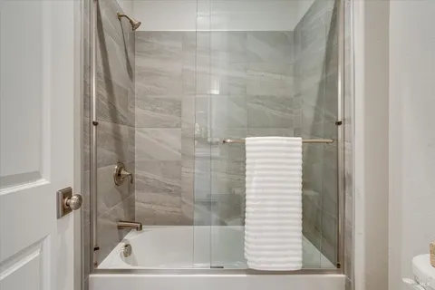 a bathroom with a shower and a bathtub