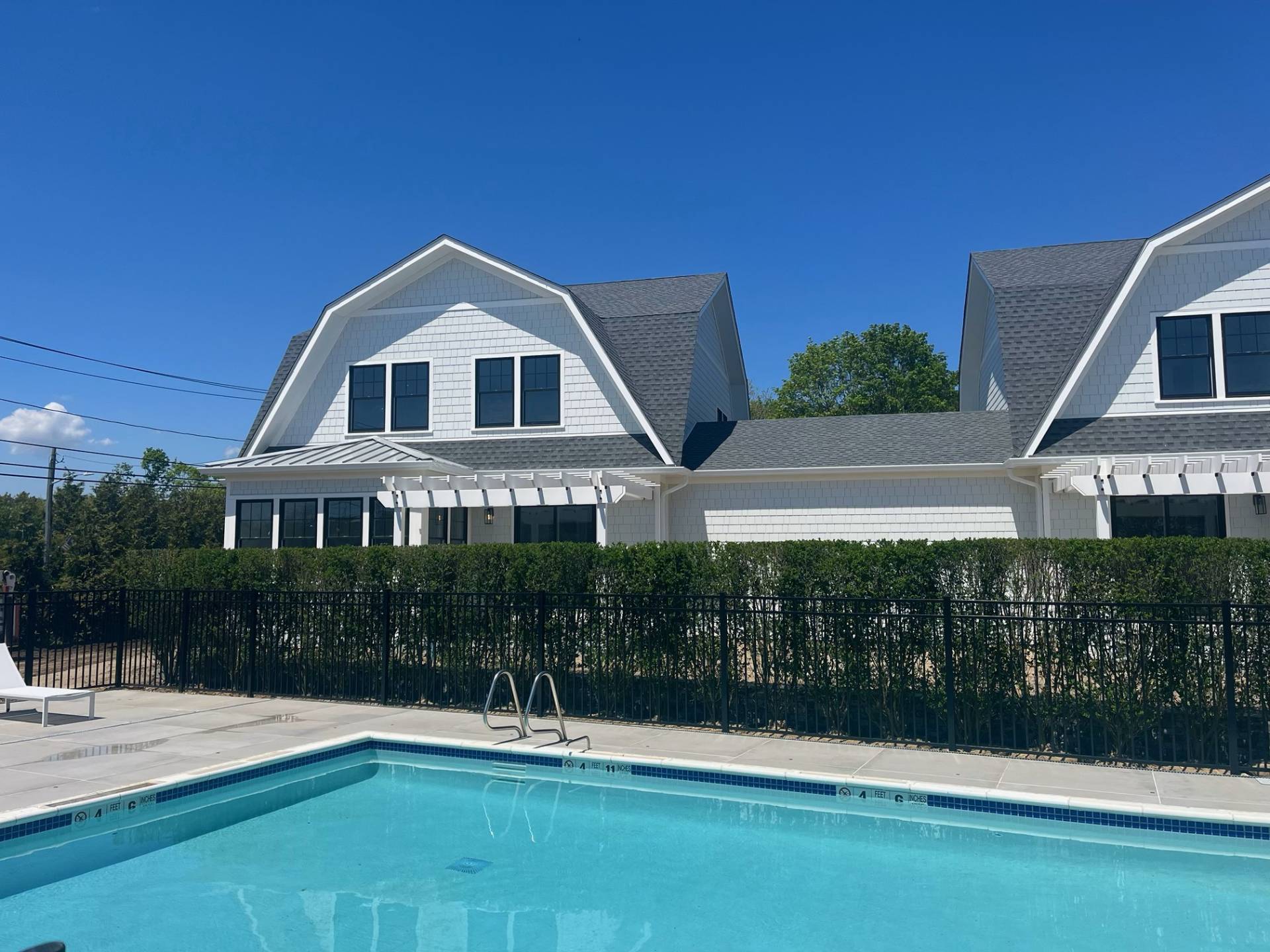 12 Depot Road, Unit 1701 Westhampton Beach, NY 11978 - Photo 11 of 18 a view of a house with a yard