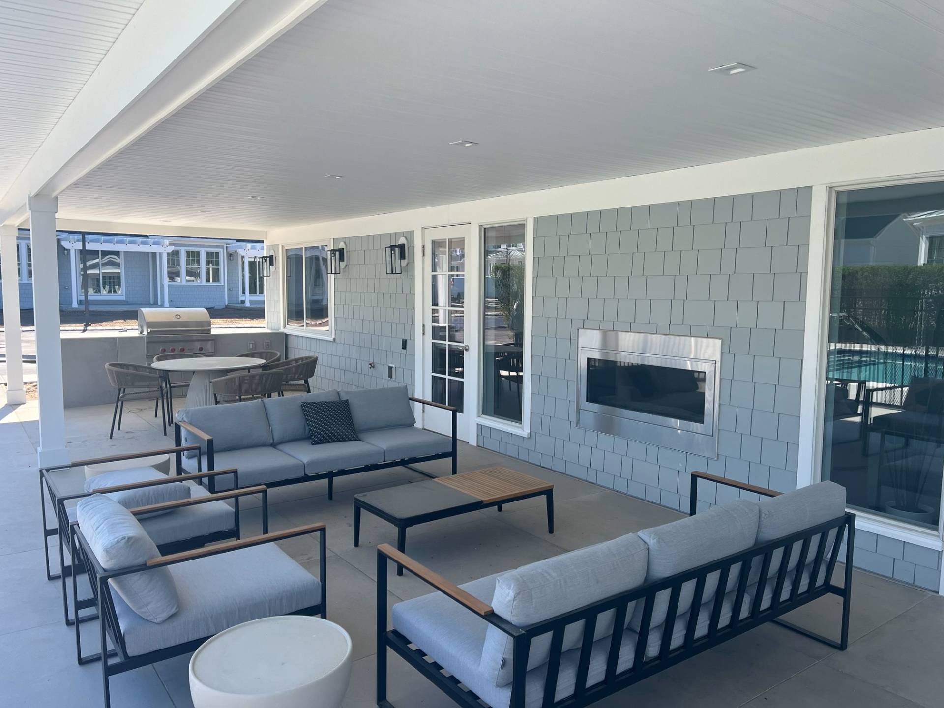 12 Depot Road, Unit 1701 Westhampton Beach, NY 11978 - Photo 12 of 18 a living room with furniture and a flat screen tv