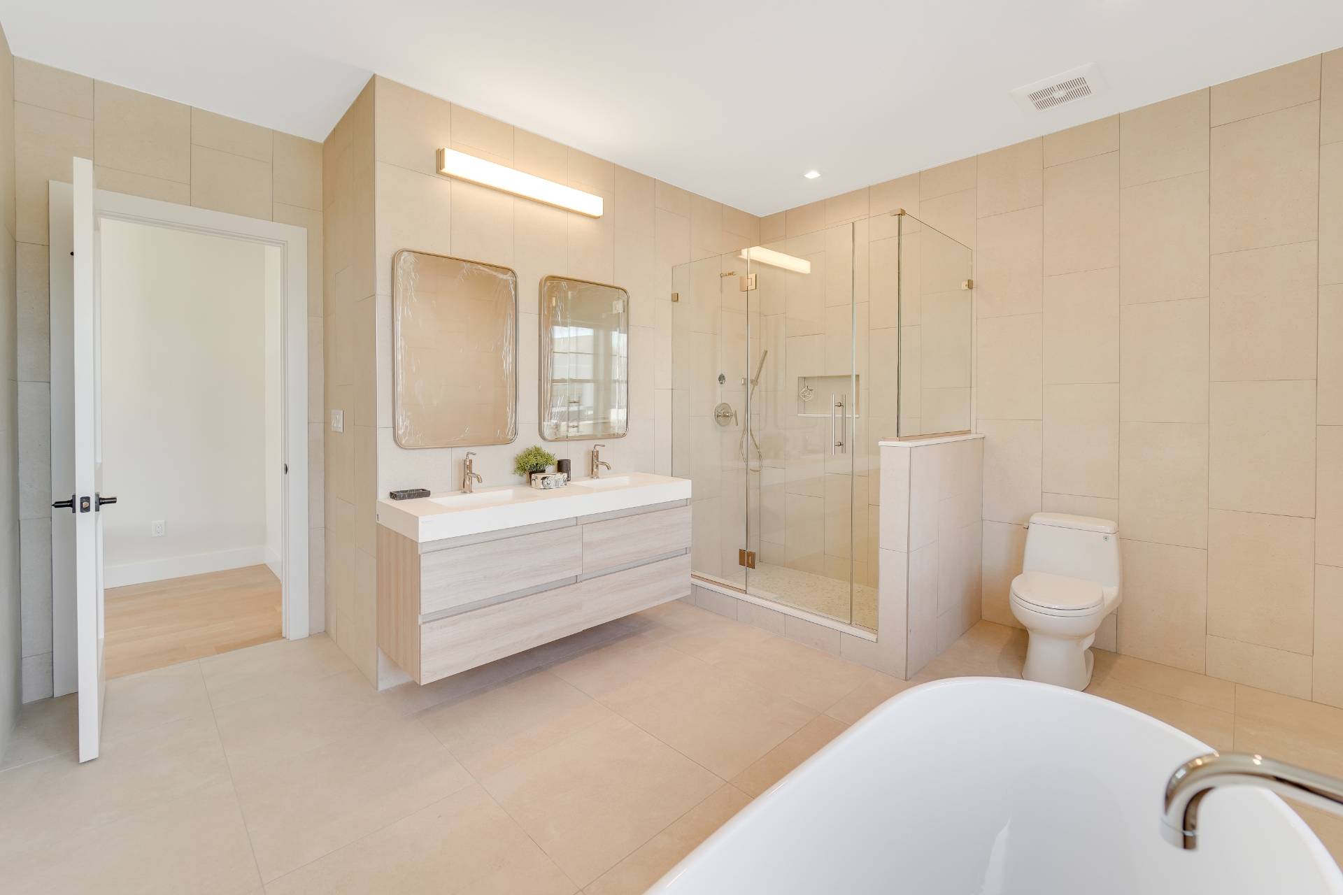 12 Depot Road, Unit 1701 Westhampton Beach, NY 11978 - Photo 8 of 18 a bathroom with a sink a toilet and shower