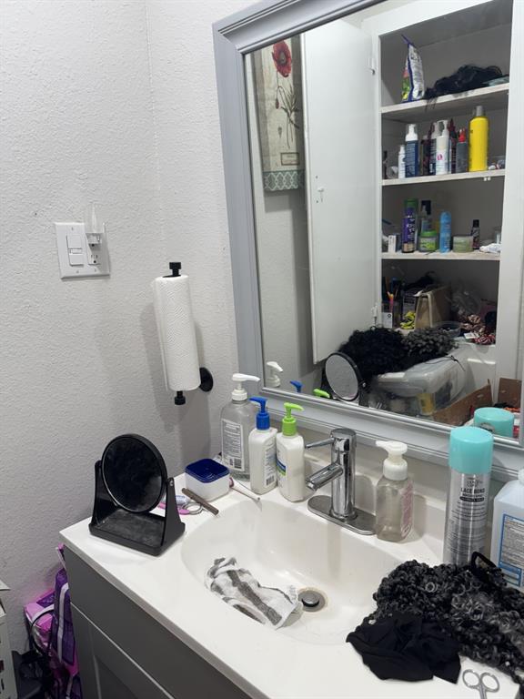 2023 Menefee Street Arlington, TX 76010 - Photo 11 of 14 a kitchen with a sink and cabinets