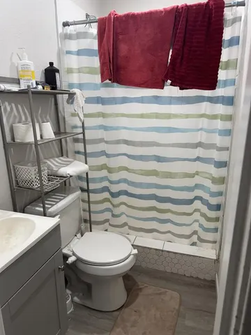 a bathroom with a toilet and a sink