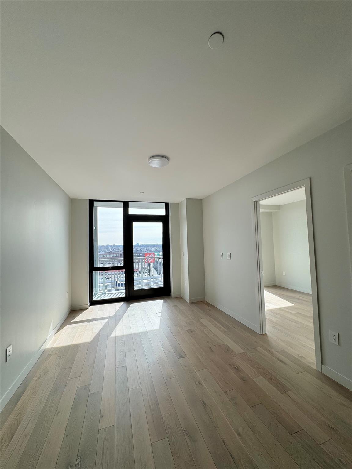 131-02b #14p 40th Road Queens, NY 11354 - Photo 1 of 1 wooden floor in an empty room with a window