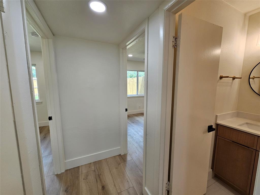 1725 R Avenue, Unit 1725 Plano, TX 75074 - Photo 9 of 20 Hallway featuring wood-finish flooring, recessed lighting, and a neutral color palette