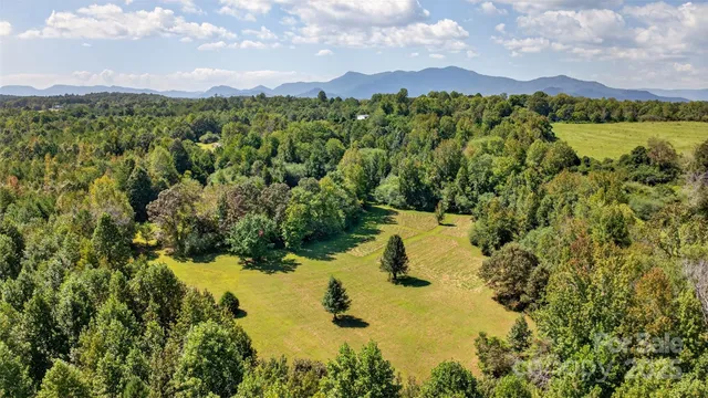 a view of a lake with a yard