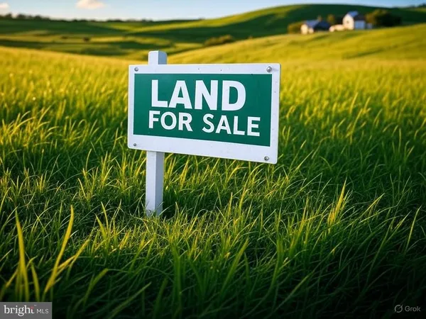 a sign broad in front of yellow and green space