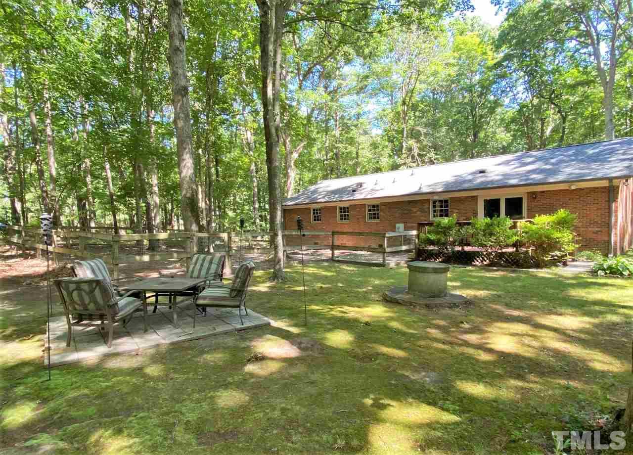 6003 Scalybark Road Durham, NC 27712 - Photo 22 of 25 a view of a house with a yard patio and a patio