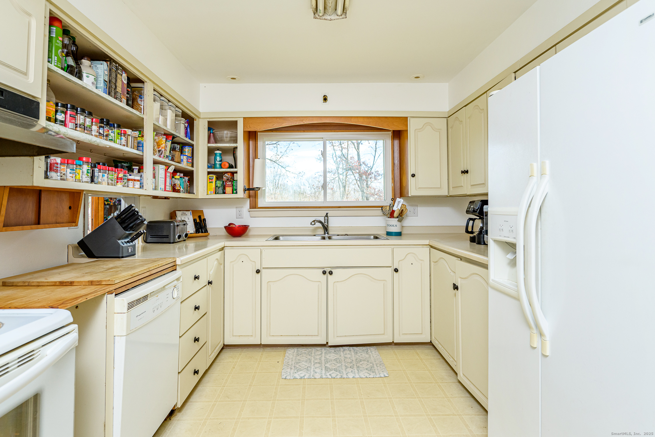 1436 North Road Killingly, CT 06241 - Photo 11 of 36 a kitchen with stainless steel appliances granite countertop a sink and a cabinets