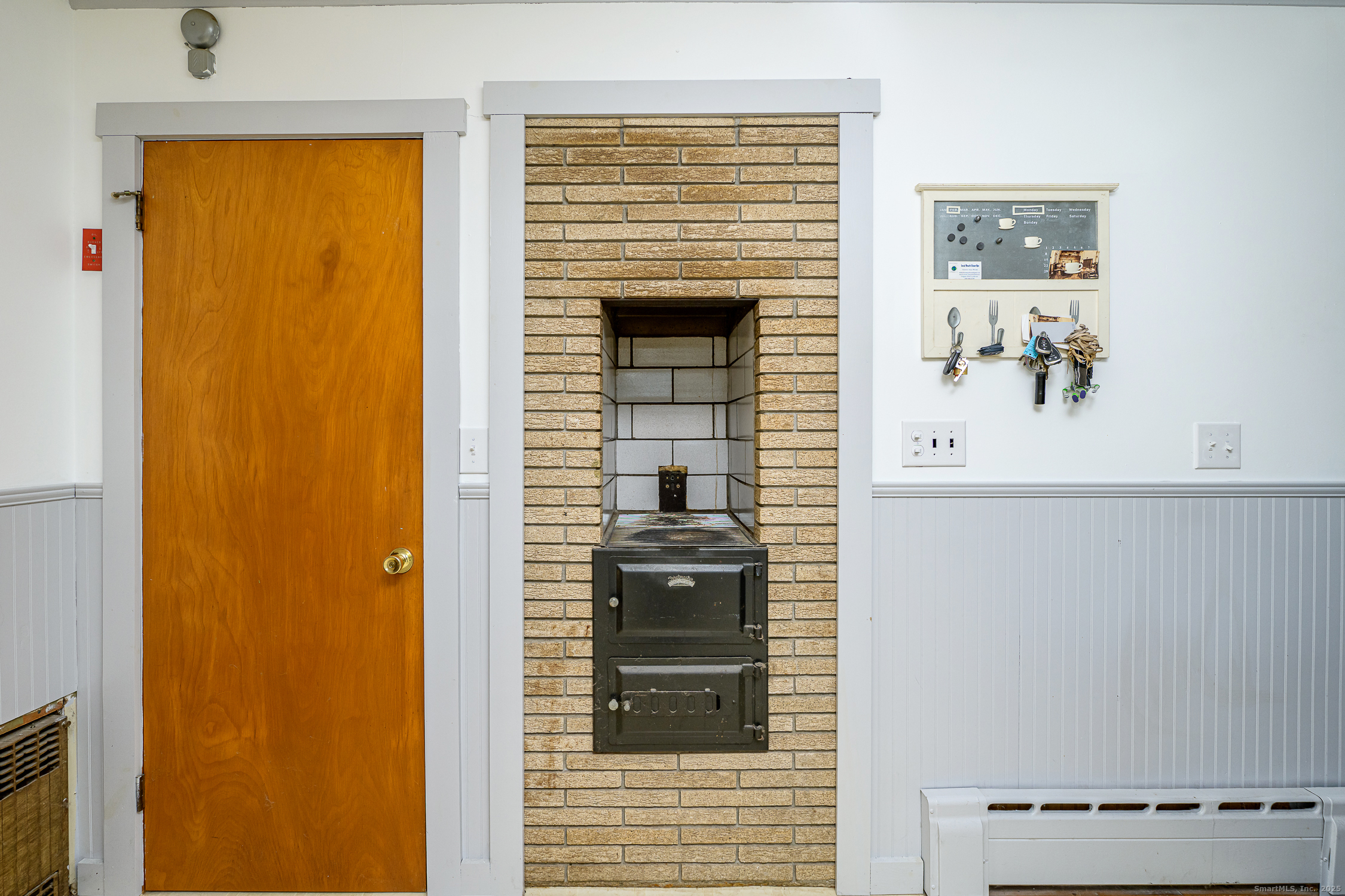 1436 North Road Killingly, CT 06241 - Photo 15 of 36 a view of a hallway with wooden cabinet and a fireplace