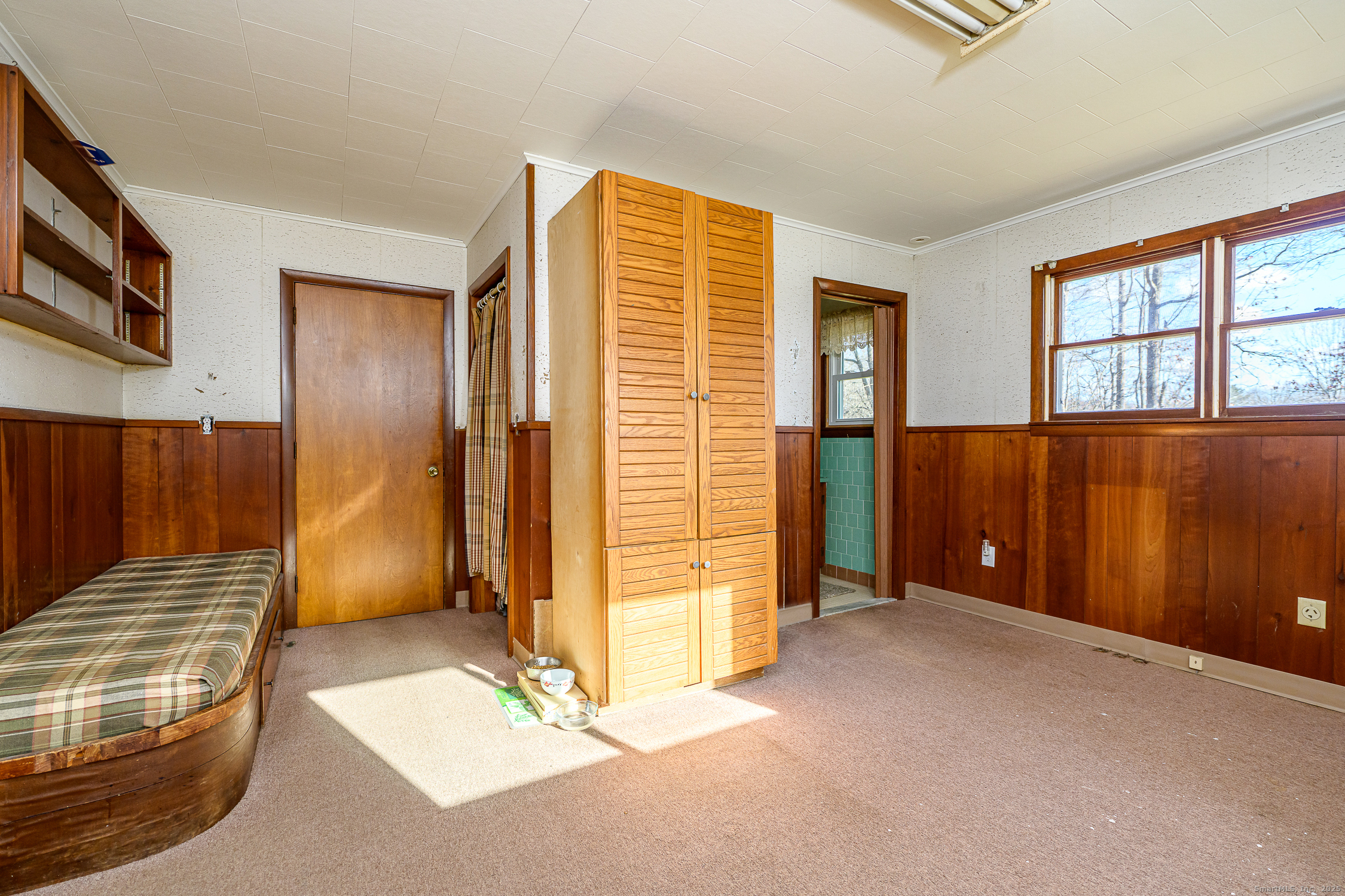 1436 North Road Killingly, CT 06241 - Photo 17 of 36 a view of an empty room with wooden floor and a window