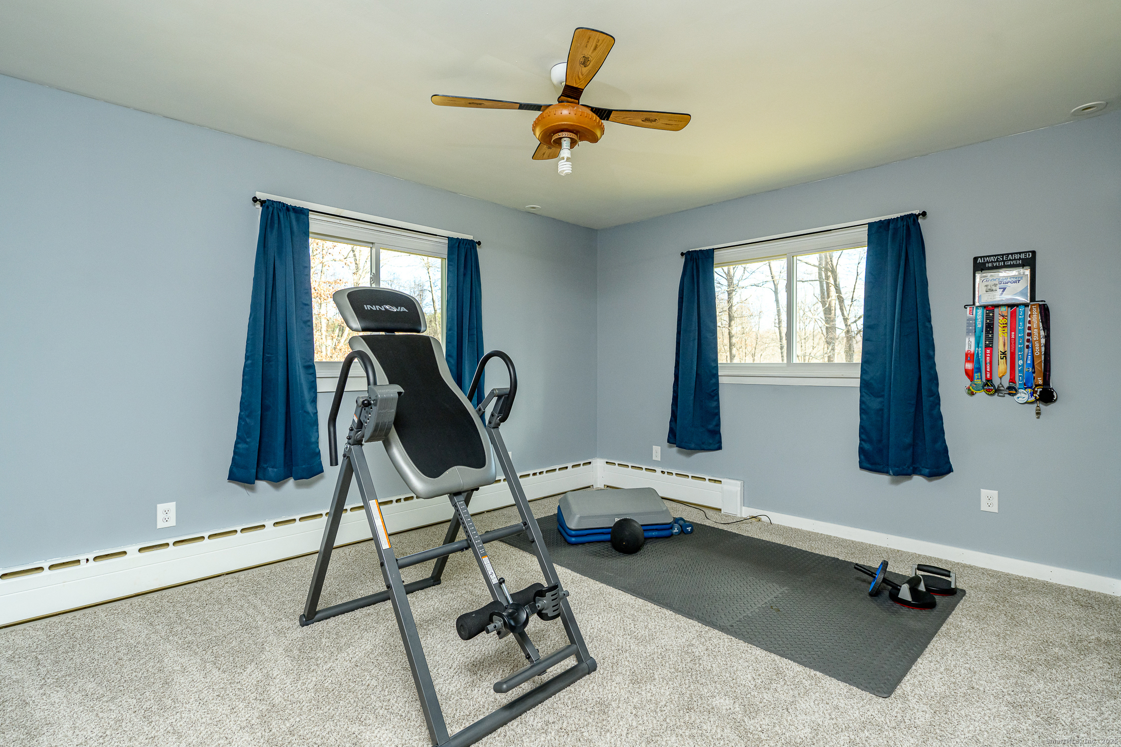 1436 North Road Killingly, CT 06241 - Photo 23 of 36 a work room with gym equipment and windows
