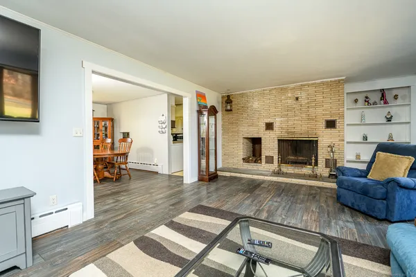 a living room with furniture and a fireplace