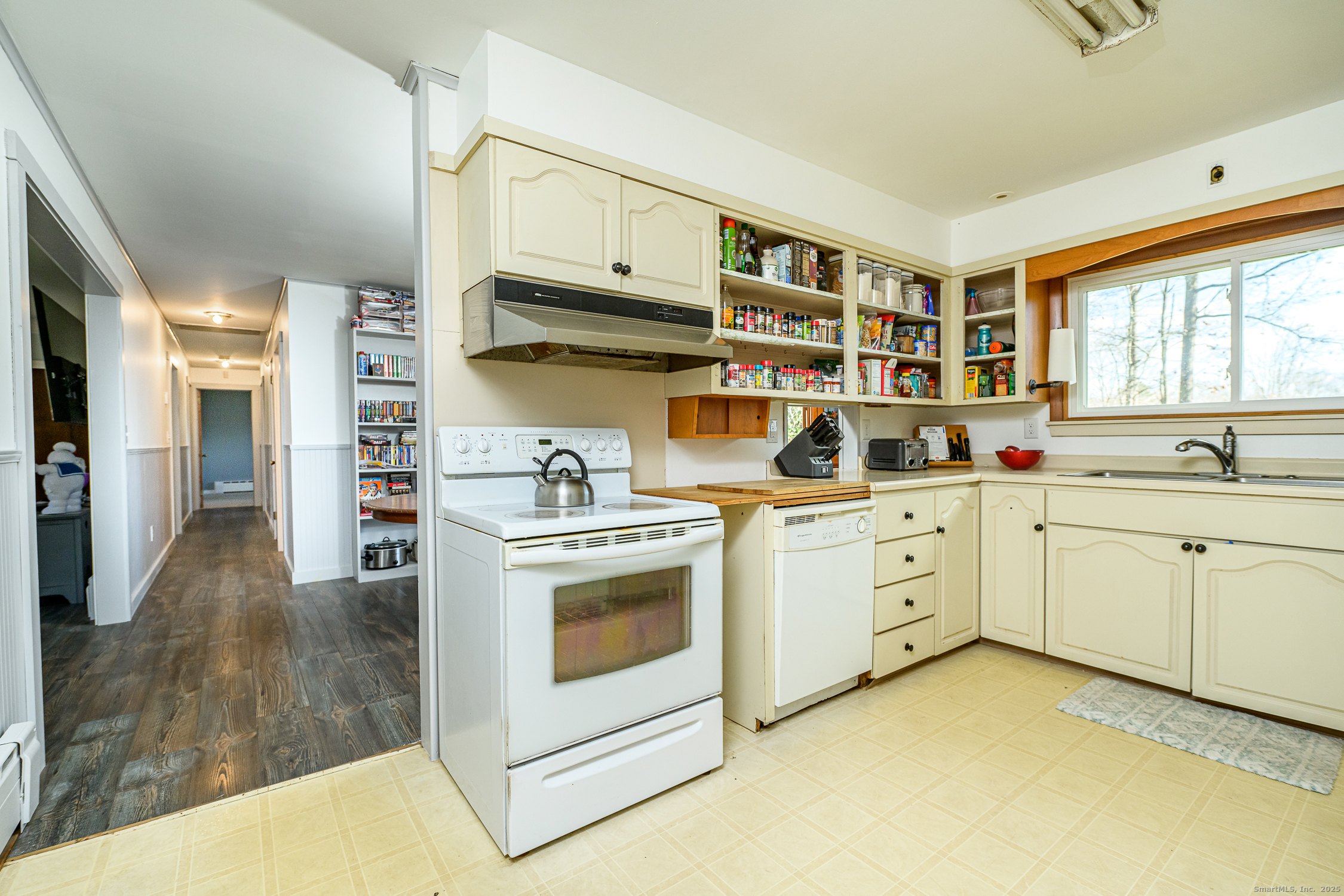 1436 North Road Killingly, CT 06241 - Photo 10 of 36 a kitchen with stainless steel appliances white cabinets and a stove