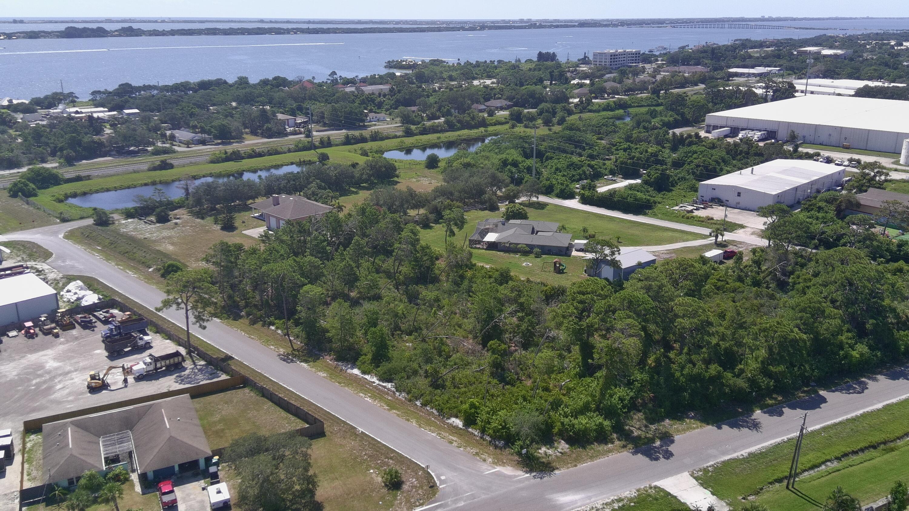 6 Waelti Drive Melbourne, FL 32940 - Photo 3 of 6 an aerial view of a city with mountains