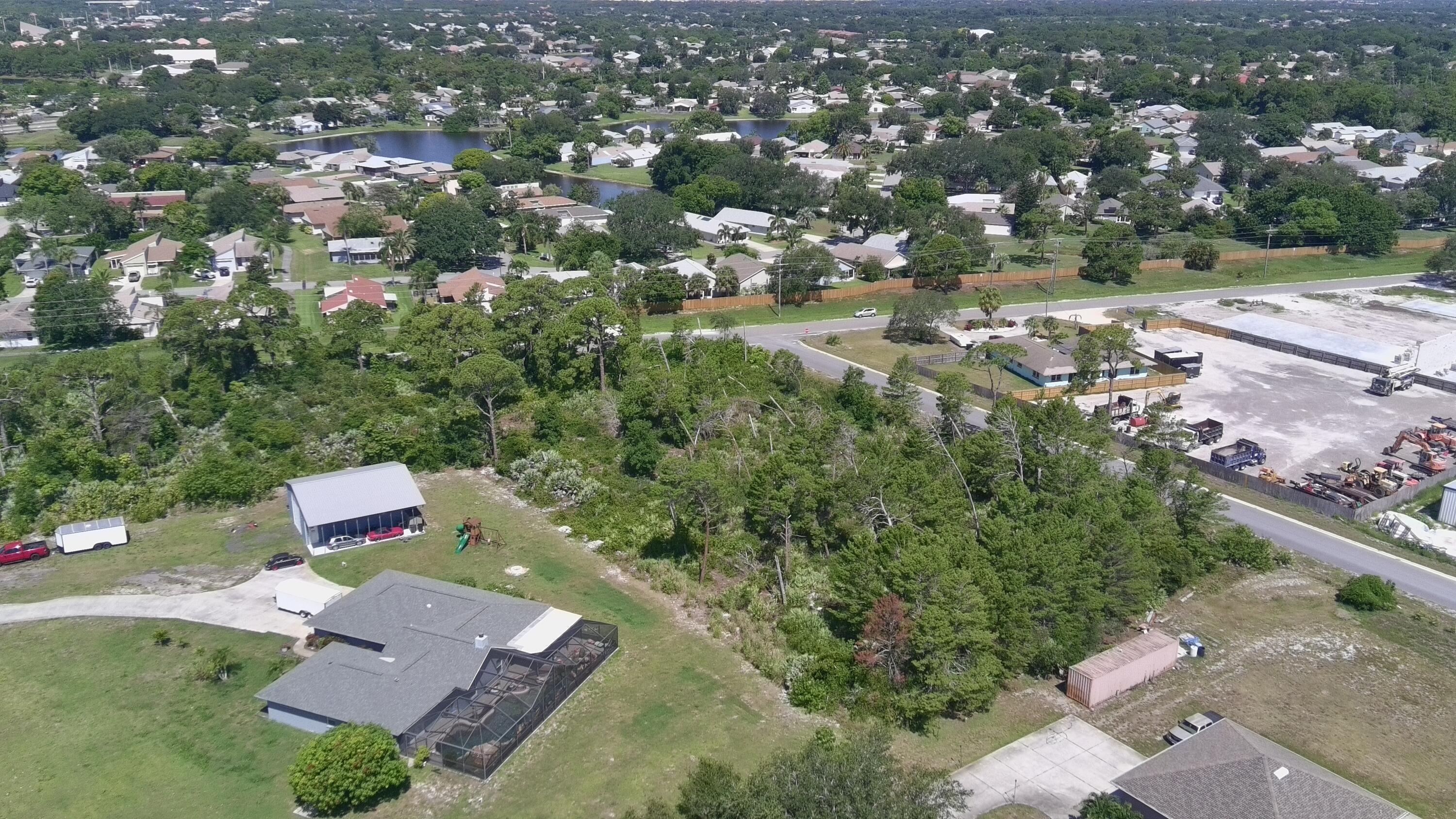 6 Waelti Drive Melbourne, FL 32940 - Photo 4 of 6 an aerial view of a city with lots of residential buildings