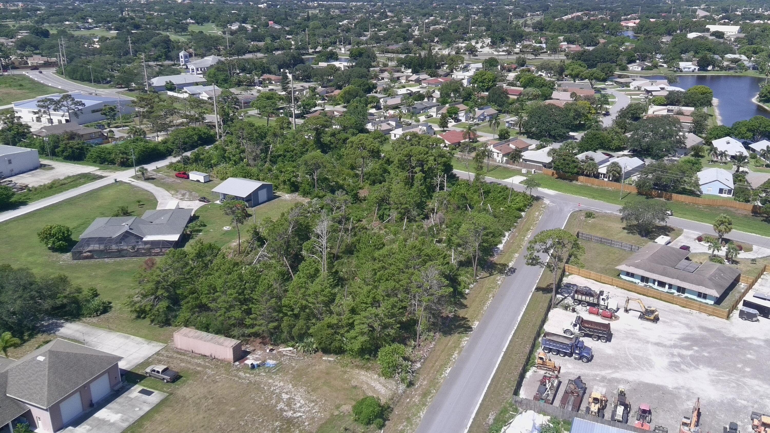 6 Waelti Drive Melbourne, FL 32940 - Photo 5 of 6 an aerial view of a city with lots of residential buildings