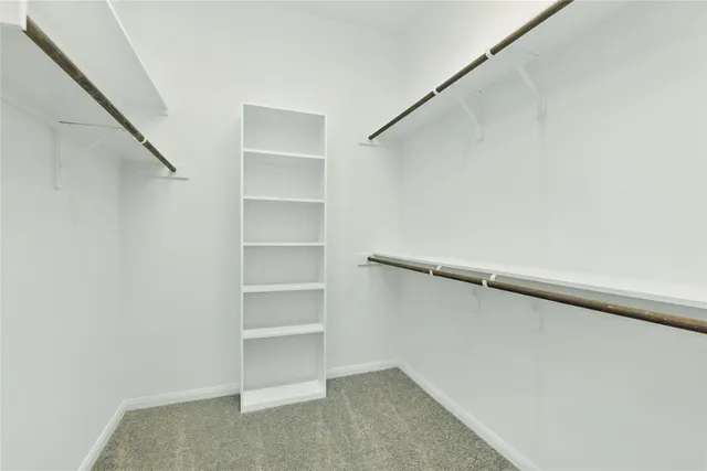 a view of an empty walk in closet