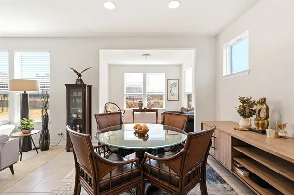 a dining room with furniture and window