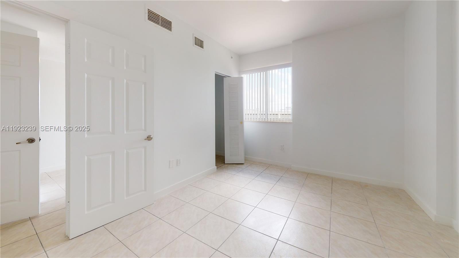 115 Southwest 42nd Avenue, Unit 501 Miami, FL 33134 - Photo 11 of 12 wooden floor in an empty room