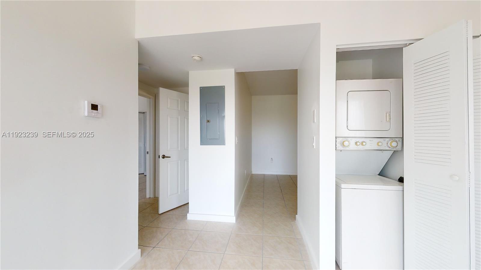 115 Southwest 42nd Avenue, Unit 501 Miami, FL 33134 - Photo 8 of 12 a view of a hallway with closet and wooden floor