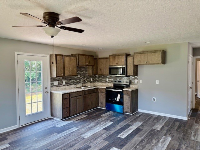 146 Hesselly Road Decherd, TN 37324 - Photo 4 of 9 a kitchen with stainless steel appliances granite countertop a stove cabinets and refrigerator