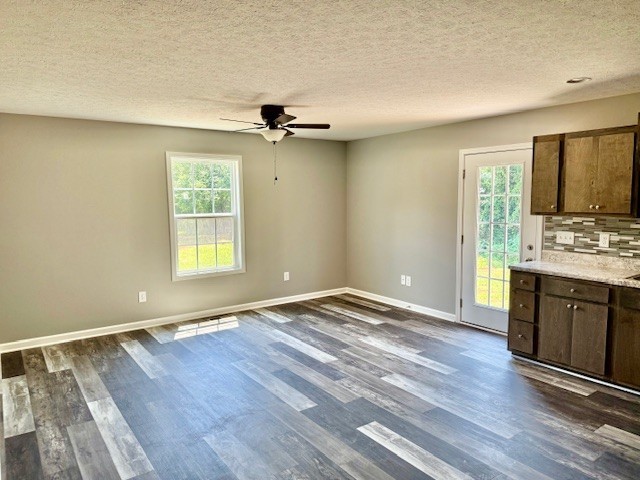 146 Hesselly Road Decherd, TN 37324 - Photo 5 of 9 wooden floor in an empty room with a window