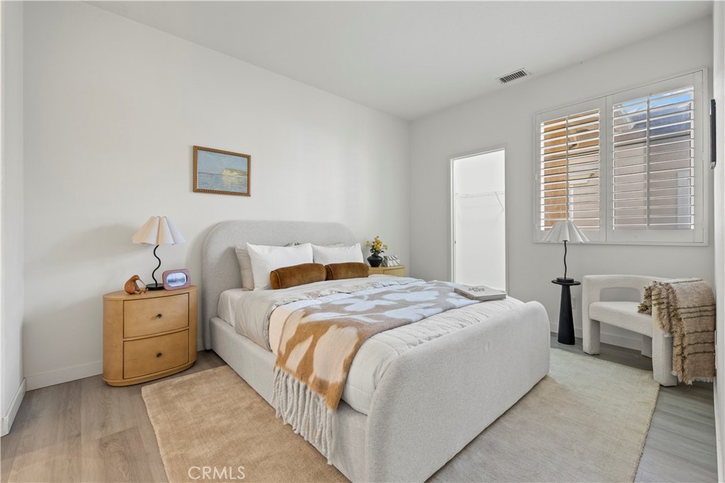 31 Poppy, Unit 50 Irvine, CA 92618 - Photo 22 of 27 a bedroom with a bed and a couch