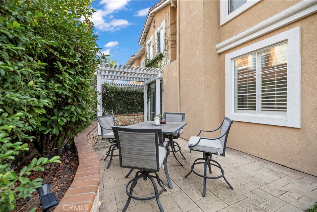 31 Poppy, Unit 50 Irvine, CA 92618 - Photo 27 of 27 a view of a two chairs in the patio