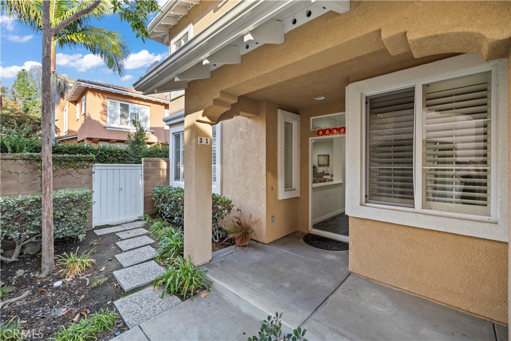 31 Poppy, Unit 50 Irvine, CA 92618 - Photo 3 of 27 a porch with seating space