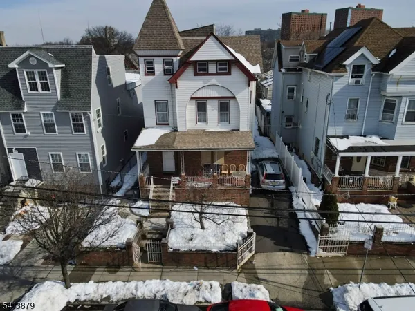 a front view of a houses with yard